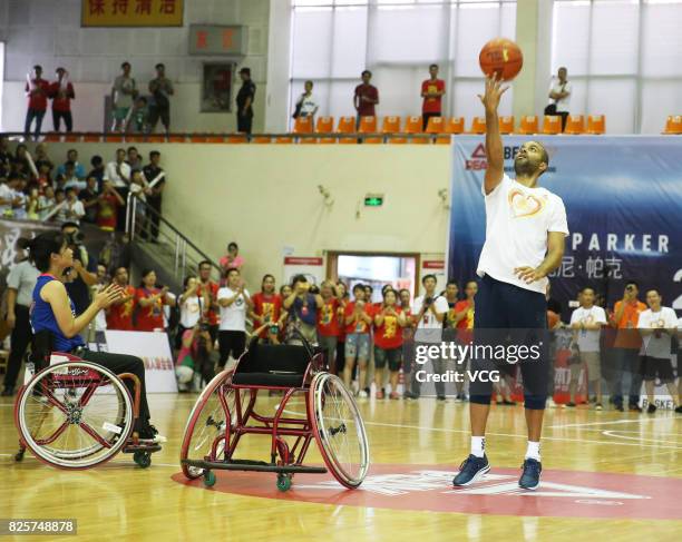 Player Tony Parker plays basketball with disabled basketball players at Guangxi Sports Center on August 2, 2017 in Guilin, Guangxi Zhuang Autonomous...