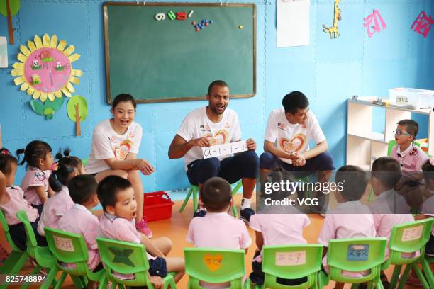 Player Tony Parker has class with kids at a rehabilitation center for disabled children on August 2, 2017 in Guilin, Guangxi Zhuang Autonomous Region...