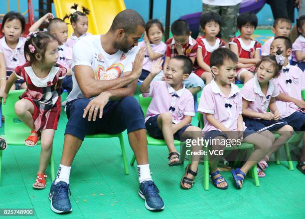 Player Tony Parker plays game with kids at a rehabilitation center for disabled children on August 2, 2017 in Guilin, Guangxi Zhuang Autonomous...