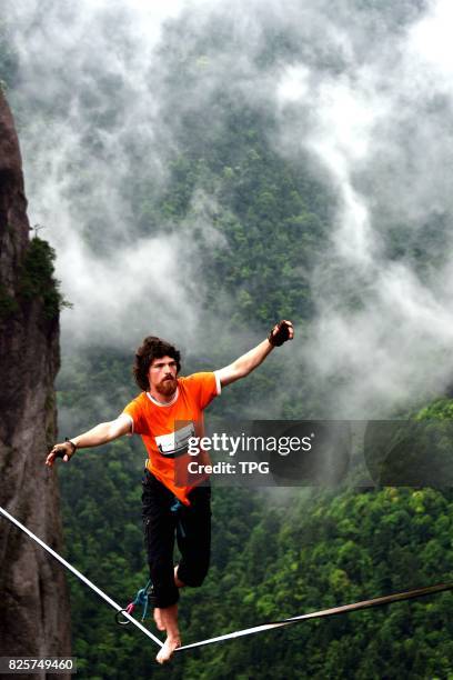 Breath-taking slacklining competition is held in Shenxianju scenic spot in Taizhou City, east Chinas Zhejiang Province, July 16, 2017. More than 30...