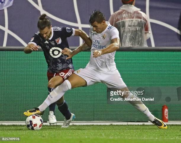 Graham Zusi of the MLS All-Stars and Theo Hernandez of Real Madrid battle for the ball along the touchline during the 2017 MLS All- Star Game at...