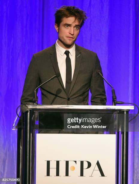 Robert Pattinson speaks onstage at the Hollywood Foreign Press Association's Grants Banquet at the Beverly Wilshire Four Seasons Hotel on August 2,...