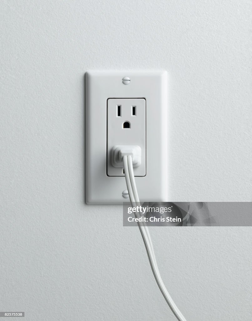 Outlet With Plug Electrical Outlet With Plug High-Res Stock Photo - Getty Images