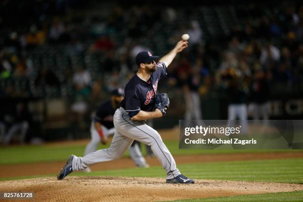 Boone Logan of the Cleveland Indians pitches during the game against the Oakland Athletics at the Oakland Alameda Coliseum on July 14, 2017 in...