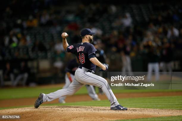 Boone Logan of the Cleveland Indians pitches during the game against the Oakland Athletics at the Oakland Alameda Coliseum on July 14, 2017 in...