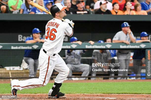 Baltimore Orioles catcher Caleb Joseph watches his second inning two run home run leave the park during an MLB game between the Kansas City Royals...