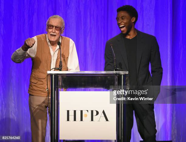 Stan Lee and Chadwick Boseman speak onstage at the Hollywood Foreign Press Association's Grants Banquet at the Beverly Wilshire Four Seasons Hotel on...