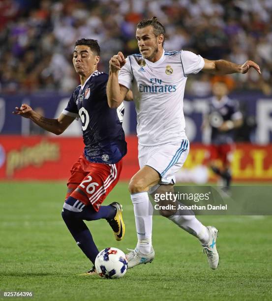 Gareth Bale of Real Madrid advances the ball under pressure from Miguel Almiron of the MLS All-Stars during the 2017 MLS All- Star Game at Soldier...