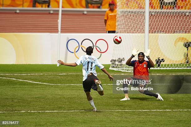 Summer Olympics: Argentina Angel Di Maria in action, chipping game-winning goal vs Nigeria Ambruse Vanzekin during Men's Gold Medal Match at National...