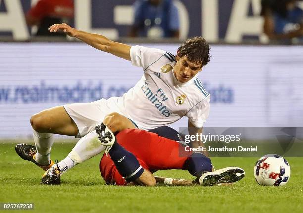 Jesus Vallejo of real Madrid lands on top of Dom Dwyer of the MLS All-Stars as they battle for the ball during the 2017 MLS All- Star Game at Soldier...