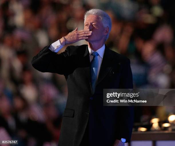 Former U.S. President Bill Clinton blows a kiss towards the box with wife U.S. Sen. Hillary Clinton and daughter Chelsea after his speech during day...