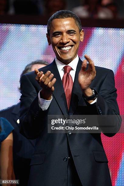 Sen. Barack Obama claps during a surprise appearance onday three of the Democratic National Convention at the Pepsi Center August 27, 2008 in Denver,...