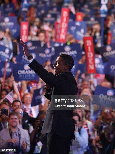 Sen. Barack Obama waves to the crowd during a surprise appearance onday three of the Democratic National Convention at the Pepsi Center August 27,...