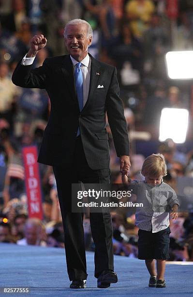 Democratic Vice-Presidential nominee Sen. Joe Biden walks with a family member on stage after his nominating speech on day three of the Democratic...