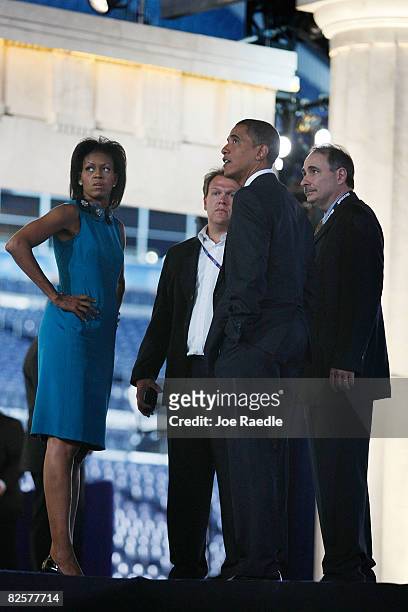 Democratic presidential nominee Sen. Barack Obama along with his wife Michelle Obama and chief strategist David Axelrod tour the stage at Invesco...