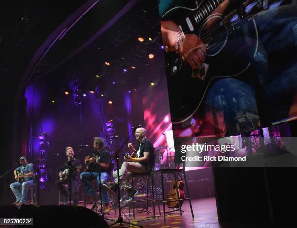 Singer/Songwriter Jason Aldean, Guitarist Tully Kennedy, Singer/Songwriters Wendell Mobley and Jerry Flowers perform during Jason Aldean's Triple...