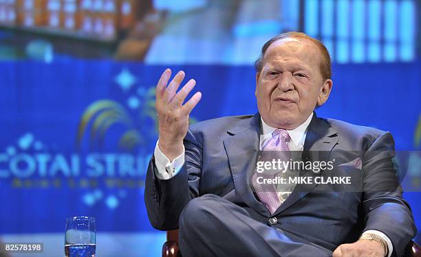 Chairman and CEO Las Vegas Sands Corps Sheldon Adelson gestures as he addresses a press confernce following the opening of The Four Seasons Hotel in...