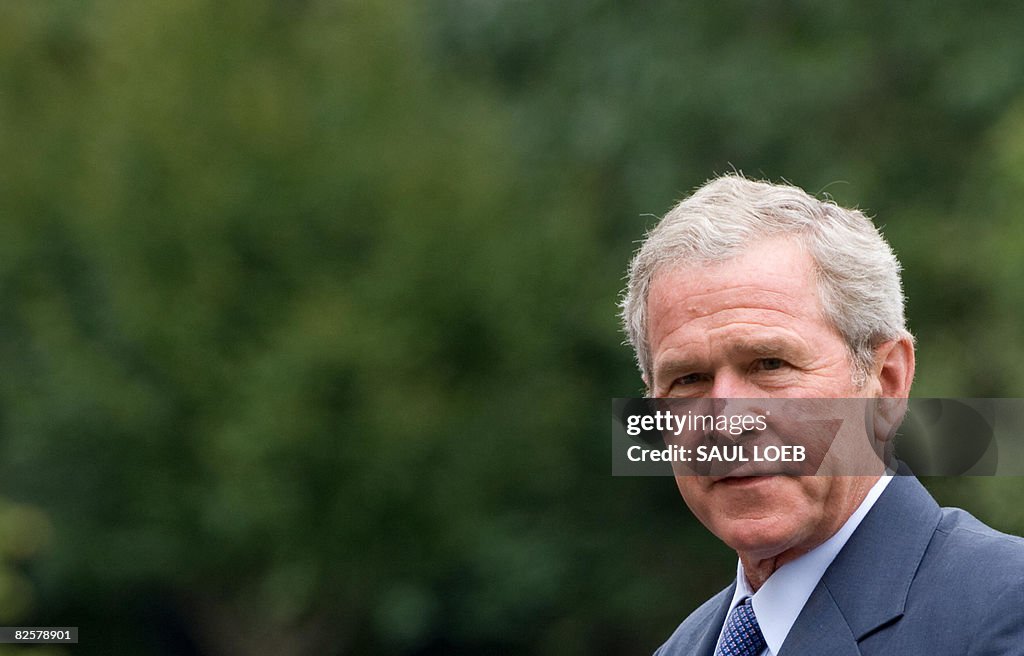 US President George W. Bush walks from M