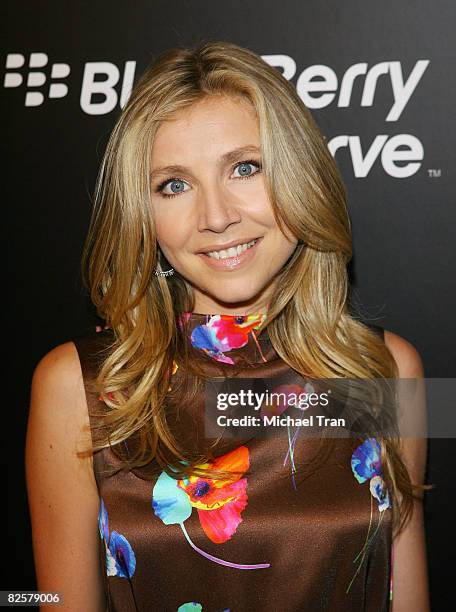 Sarah Chalke arrives to the launch party of the pink Blackberry Curve on the 15th Anniversary of the Intermix clothing boutique held at Intermix on...