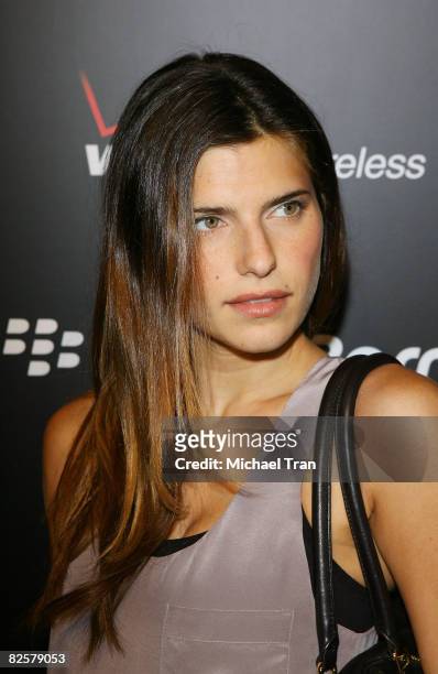 Lake Bell arrives to the launch party of the pink Blackberry Curve on the 15th Anniversary of the Intermix clothing boutique held at Intermix on...