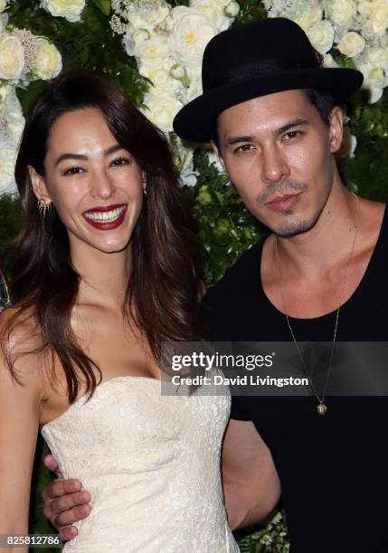 Emi Renata and actor Lewis Tan attend the Maison St-Germain LA debut hosted by Lily Kwong at the Houdini Estate on August 2, 2017 in Los Angeles,...