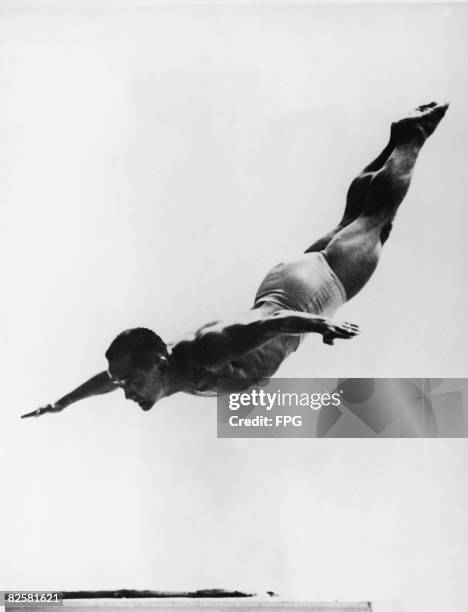 American diving champion Sammy Lee in the air during a dive at the 1952 Olympic Games, Helsinki, Finland, mid 1992.