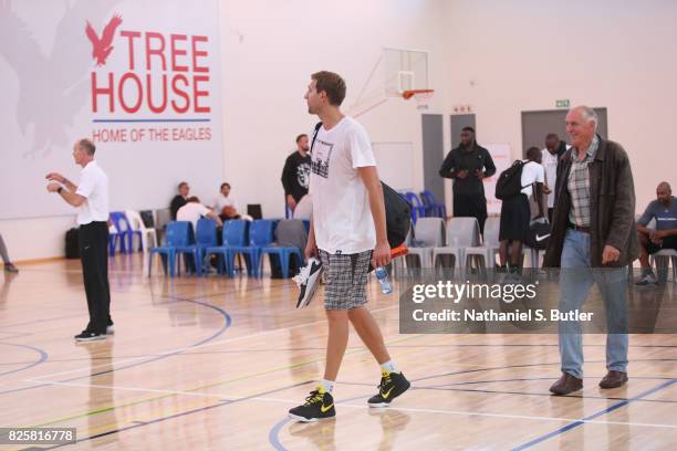 Holger Geschwindner and Dirk Nowitzki of the Dallas Mavericks goes through a workout as part of Basketball Without Borders Africa at the American...