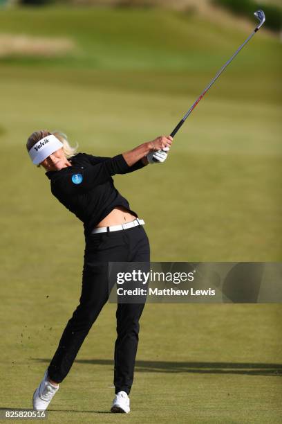 Carly Booth of Scotland hits her second shot on the 3rd hole during the first round of the Ricoh Women's British Open at Kingsbarns Golf Links on...