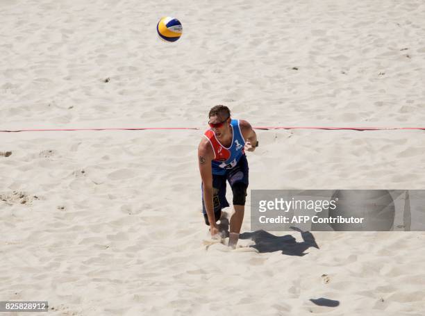 Theodore Allan Theo Brunner from the USA is pictured during a game on the Danube Island in Vienna, on August 2, 2017 during the 11th Beach Volleyball...