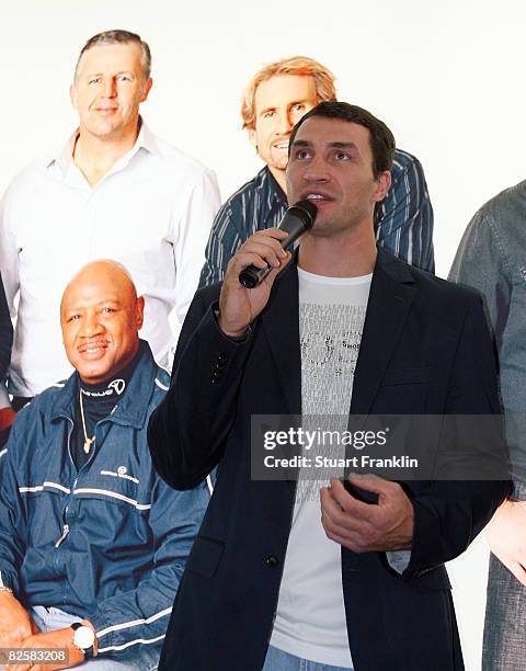 World boxing champion Wladimir Klitschko of the Ukraine stands by a photograph of former boxer Marvellous Marvin Hagler at the opening of the Laureus...