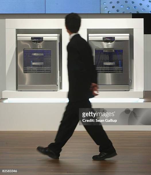 Man walks past energy-efficient ovens at the Bosch stand ahead of the opening evening at the IFA consumer elctronics trade fair on August 28, 2008 in...