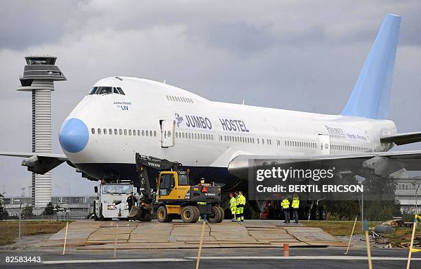 The Boeing 747-200e Boeing 747-200 that will be the world's first Jumbo Hostel is towed to its parking spot at the highway entrance to Stockholm...