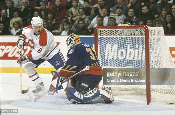 Canadiens forward Mark Recchi in alone against Blues netminder Grant Fuhr in a game at the Molson Centre during the 1996-97 season