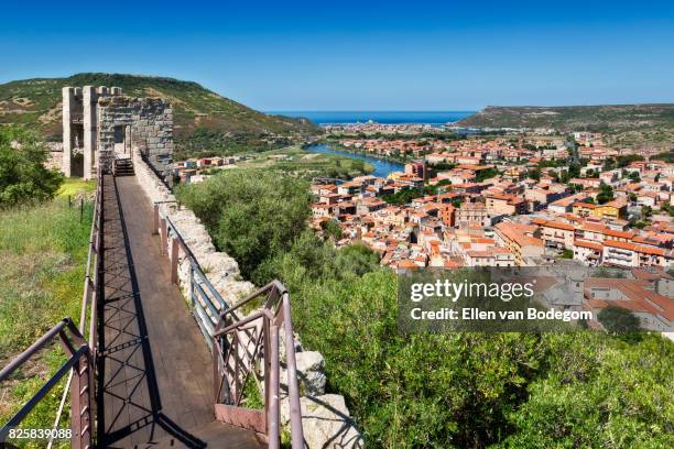 elevated view from medieval castle over the colourful town of bosa along the temo river - oristano stockfoto's en -beelden