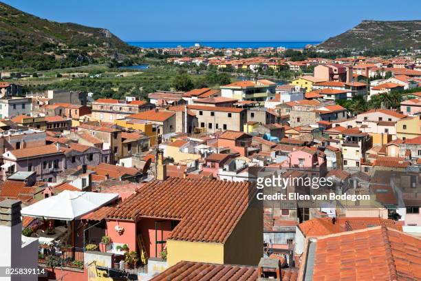 elevated view from medieval castle over the colourful town of bosa along the temo river - oristano fotografías e imágenes de stock