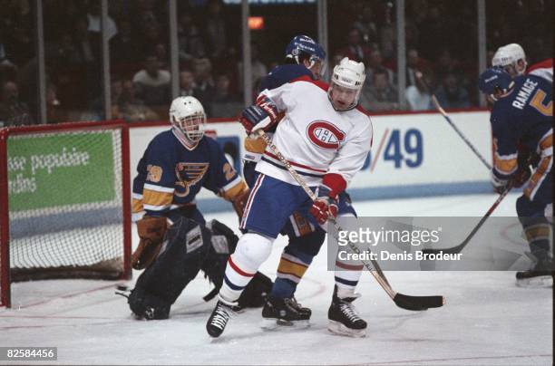 Canadiens forward Ryan Walter screen Blues goaltender Greg Millen in game action at the Montreal Forum during the 1987-88 season.