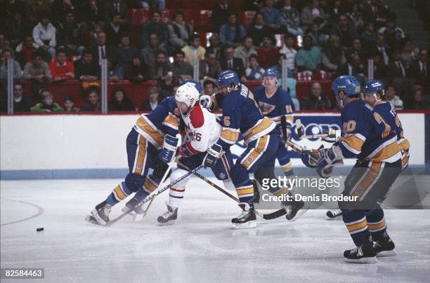 Canadiens forward Mats Naslund surrounded by Blues players at the Montreal Forum during the 1987-88 season.