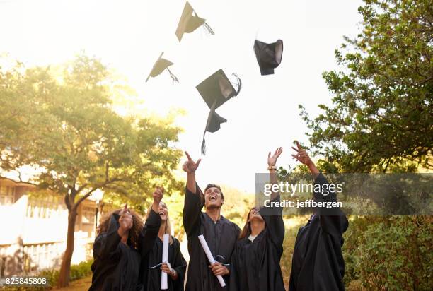 graduation is a time for celebrating an achievement - cap hat stock pictures, royalty-free photos & images