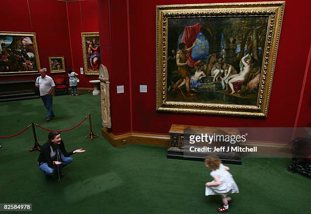 Young girl views the Titian painting, Diana and Actaeon, at the National Galleries of Scotland August 28, 2008 in Edinburgh, Scotland. The two Titian...