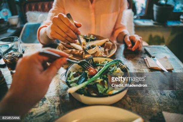 sharing food - meal stock pictures, royalty-free photos & images