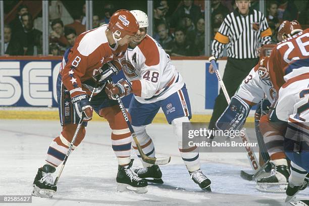 Capitals forward Dmitri Khristich and Canadiens defenceman JJ Daigneault jostle for position in front of goaltender Jocelyn Thibault while incoming...