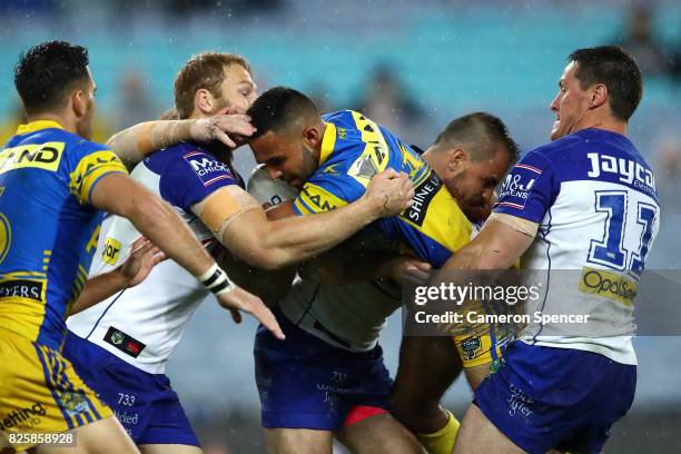 Bevan French of the Eels is tackled during the round 22 NRL match between the Canterbury Bulldogs and the Parramatta Eels at ANZ Stadium on August 3,...