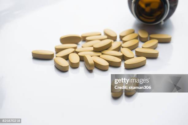 dietary supplement tablet and vitamin tablet medicine (pharmacy) and bottle  on white background - vitamins and minerals stock pictures, royalty-free photos & images