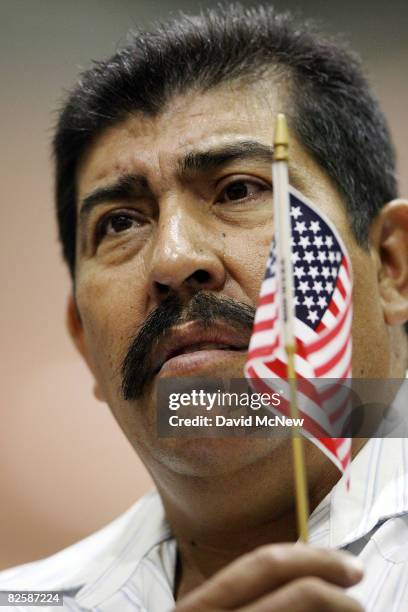 Francisco Javier Hernandez, who came to the US from Zacatecas, Mexico 35 years ago, gains US citizenship as 18,418 people are sworn in as US citizens...