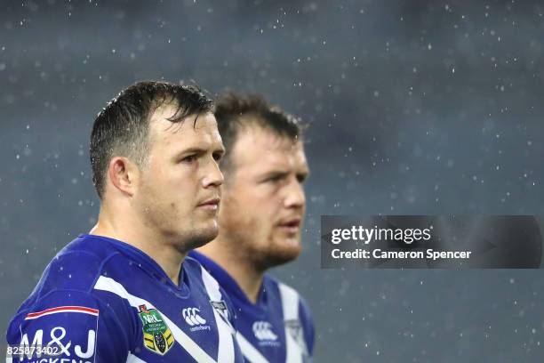 Brett Morris of the Bulldogs and Josh Morris of the Bulldogs look on during the round 22 NRL match between the Canterbury Bulldogs and the Parramatta...