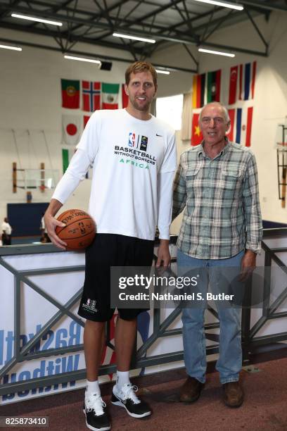 Dirk Nowitzki of Team World and trainer Holger Geschwindner poses for a portrait as part of the Basketball Without Borders Africa at the American...