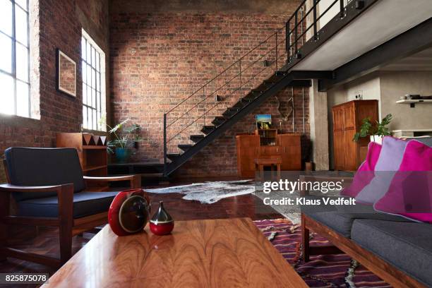 interior of new york style loft, holiday rental apartment - appartement salon stockfoto's en -beelden
