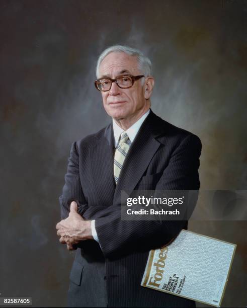 Studio portrait of American businessman and Forbes magazine publisher Malcolm Forbes , New York, New York, 1987. He stands with his arms crossed and...