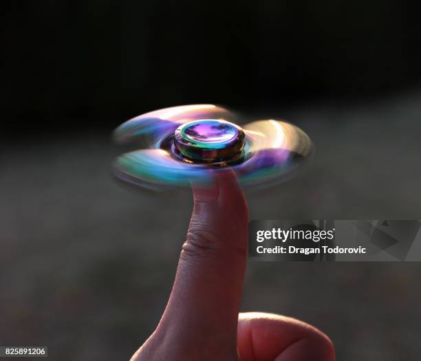 spinning - fidget spinner stock pictures, royalty-free photos & images