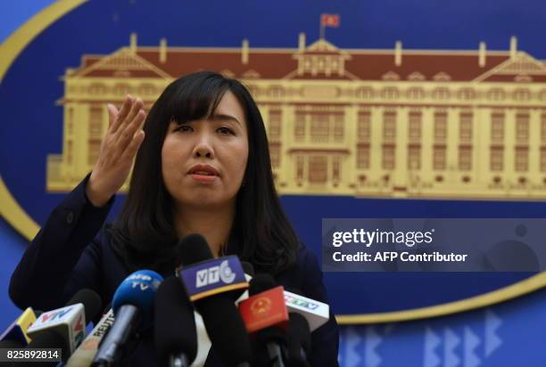 Vietnam's Foreign Ministry spokeswoman Le Thi Thu Hang takes questions during a press conference in Hanoi on August 3, 2017. Portrayed by the...